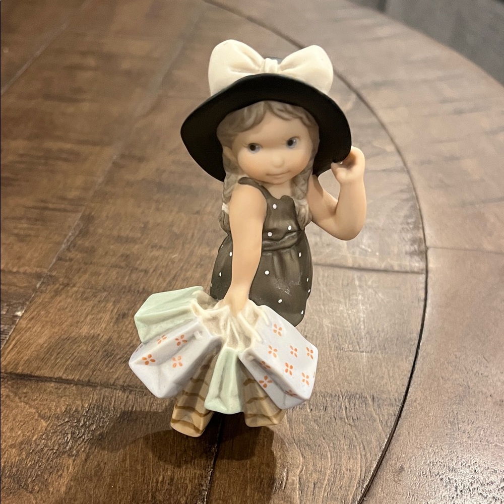 Kim Anderson Figurine with Hat and Shopping Bags